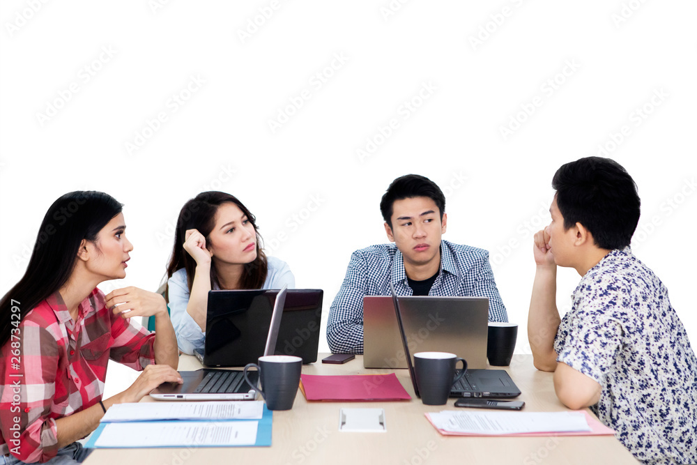 Young man discussing with his colleagues on studio Young man discussing with his colleagues on studio