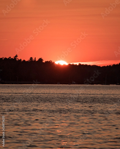 Sunset on Bar Harbor Orange and blue sunset on the ocean in Maine.