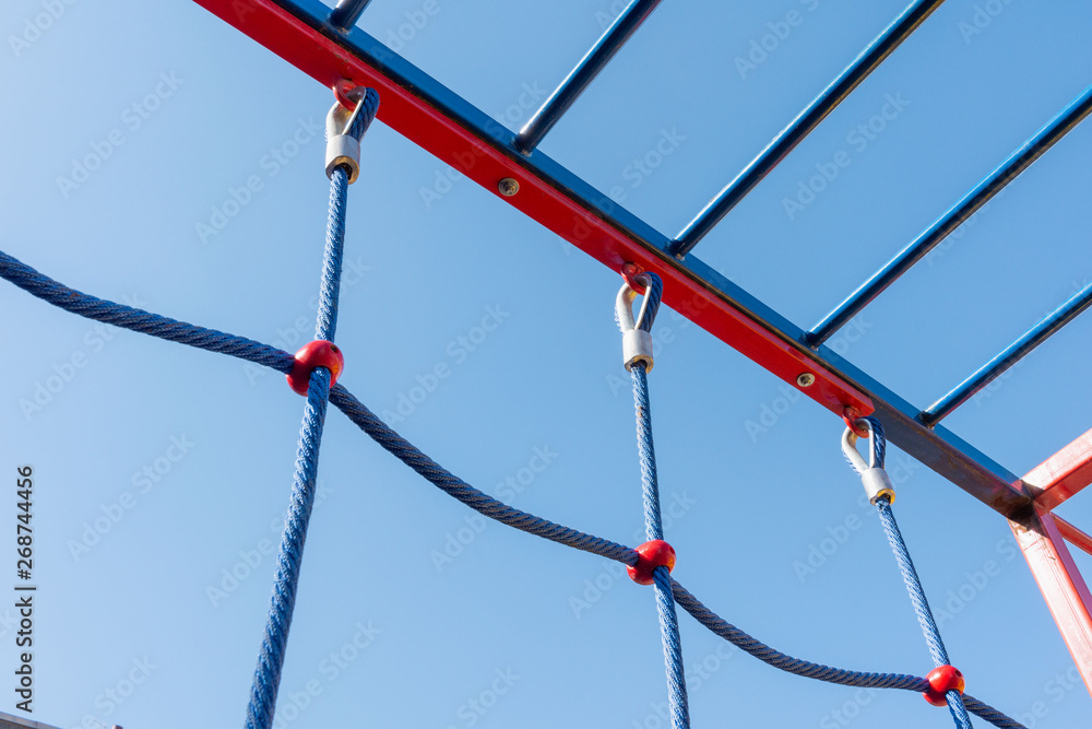 Network and nylon rope on the playground. Equipment for fun and sports for children