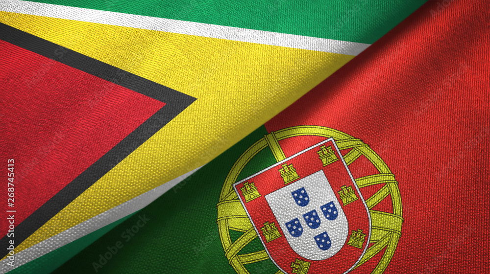 Fototapeta premium Guyana and Portugal two flags textile cloth, fabric texture