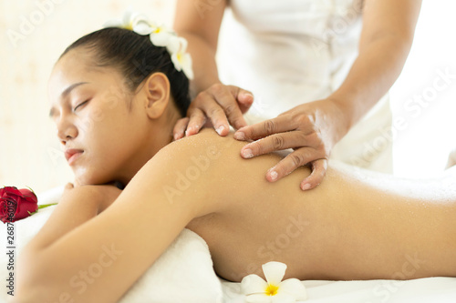 Beautiful young Asian woman having exfoliation treatment in spa salon. spa beauty treatment, skin care concept