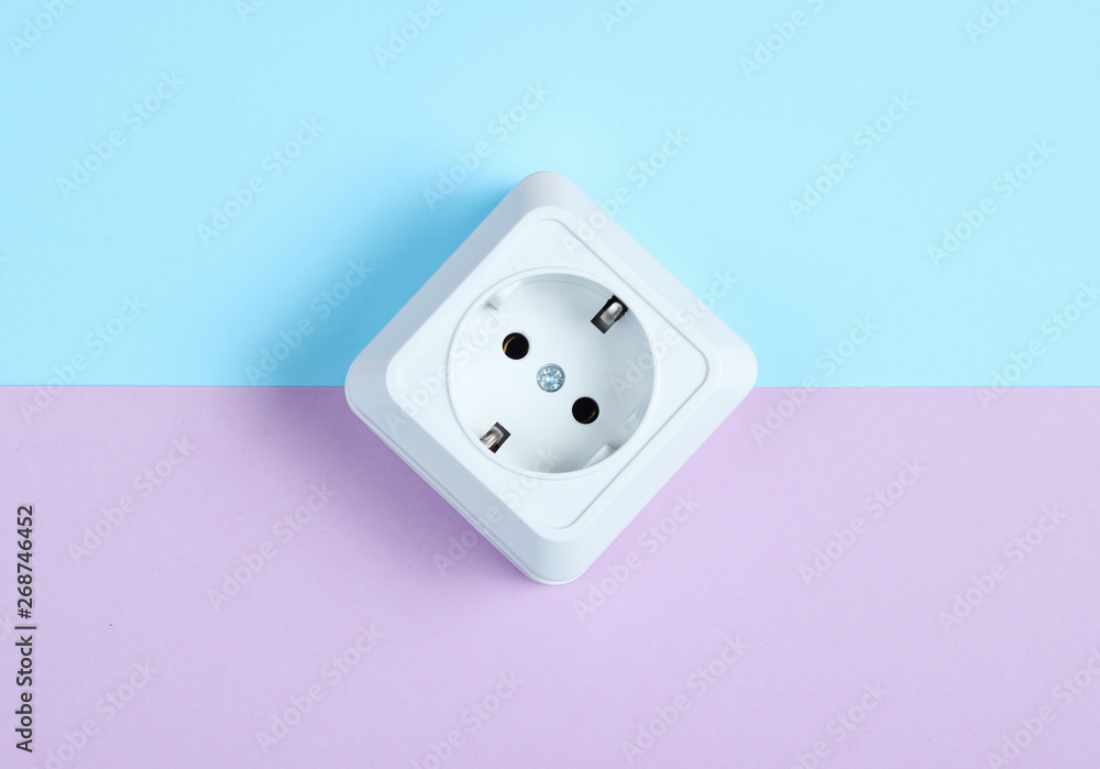 White plastic power socket on pastel background. Minimalism White plastic power socket on pastel background. Minimalism