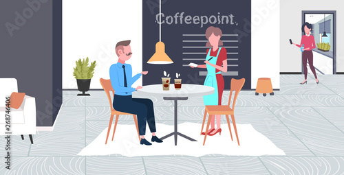 waitress taking order from businessman visitor cafe worker in apron serving drinks to man having break business time concept modern coffee point interior flat full length horizontal