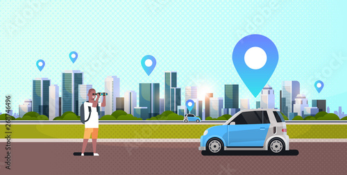 african american man looking through binoculars searching automobile vehicle rent car sharing concept transportation carsharing service modern cityscape background horizontal