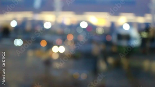 Wallpaper Mural Blurry abstract background of moving and flashing bokeh lights around a parked airplane at the departure gate of an airport. Torontodigital.ca