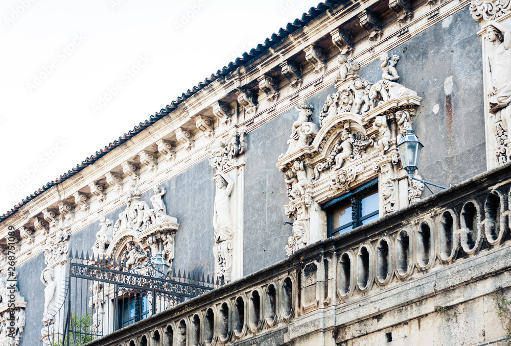 Decoration stucco of balcony in old baroque building in Catania, traditional architecture of Sicily, Italy.