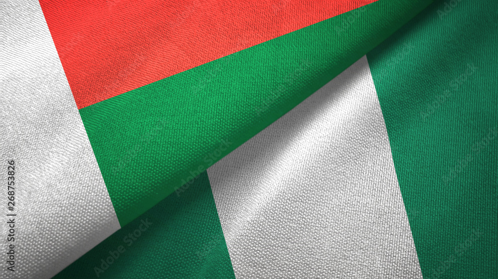 Obraz premium Madagascar and Nigeria two flags textile cloth, fabric texture