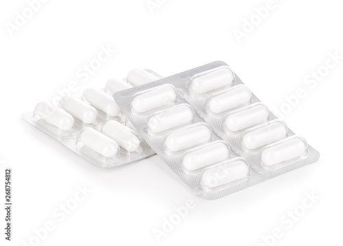 Slika na platnu Capsule pills in blister pack close-up isolated on a white background