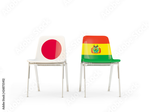 Two chairs with flags of Japan and bolivia isolated on white