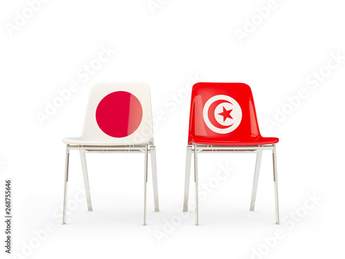 Two chairs with flags of Japan and tunisia isolated on white photo