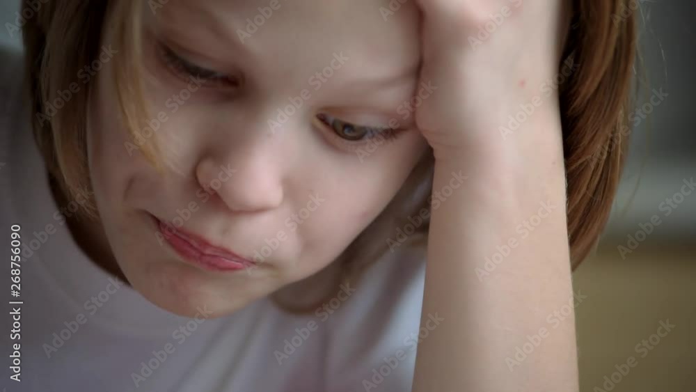 little blond boy taking pill of vitamin C little blond boy taking pill of vitamin C