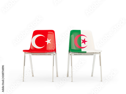 Two chairs with flags of Turkey and algeria isolated on white photo