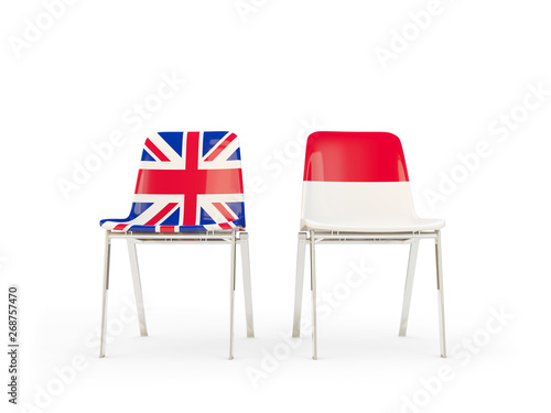 Two chairs with flags of United Kingdom and indonesia isolated on white