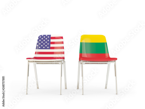 Two chairs with flags of United States and lithuania isolated on white