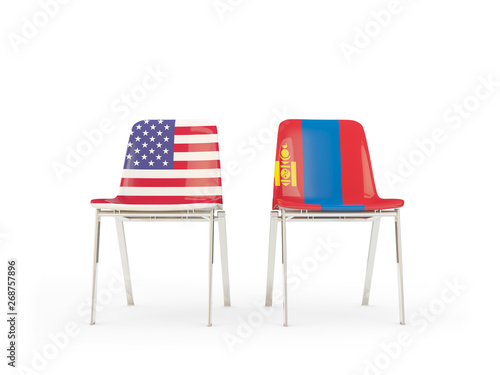 Two chairs with flags of United States and mongolia isolated on white