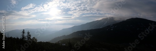 Fototapeta Naklejka Na Ścianę i Meble -  Babia Gora - mountain range in Beskid Zywiecki during spring with fog, clouds and sun
