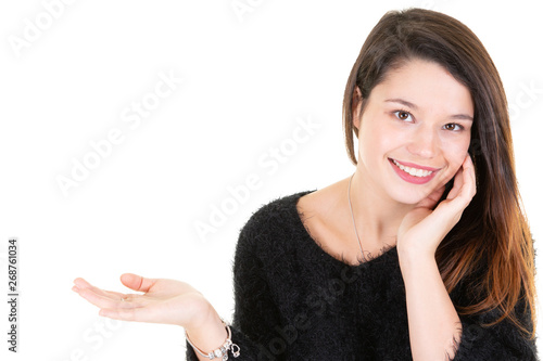 Smiling pretty business woman presenting finger side copy space white wall background