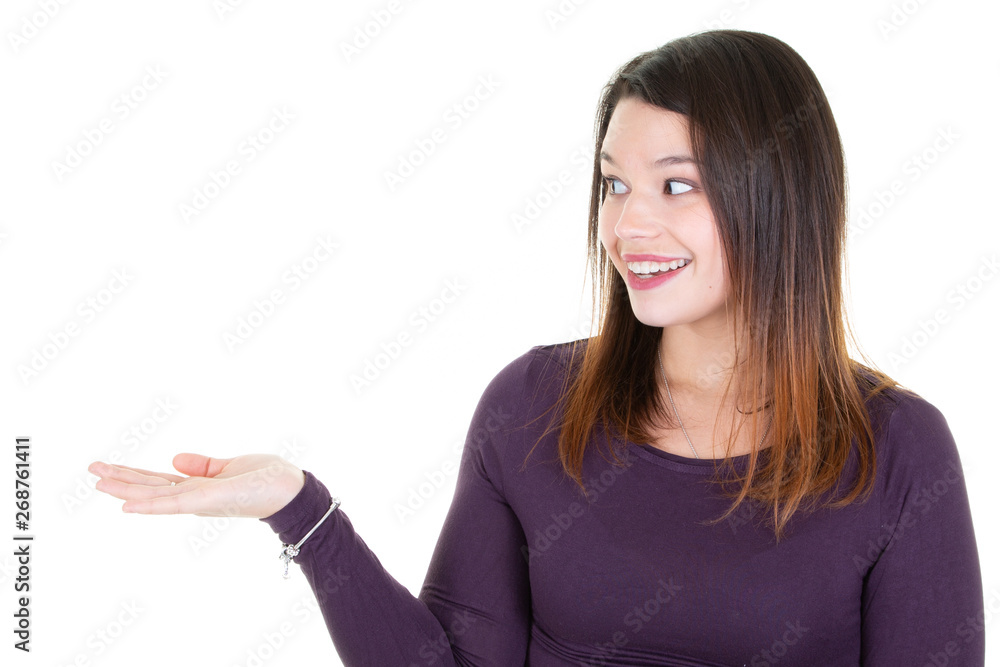 Portrait of an excited young woman brunette pointing aside looking blank side Portrait of an excited young woman brunette pointing aside looking blank side