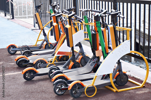 Electric push scooters for rent in parking