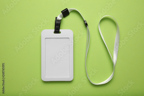 Identification badge, blank id, personal plastic card mockup on green background.