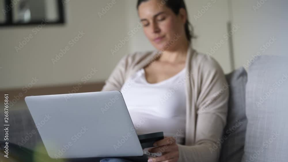 Pregnant woman doing online shopping Pregnant woman doing online shopping