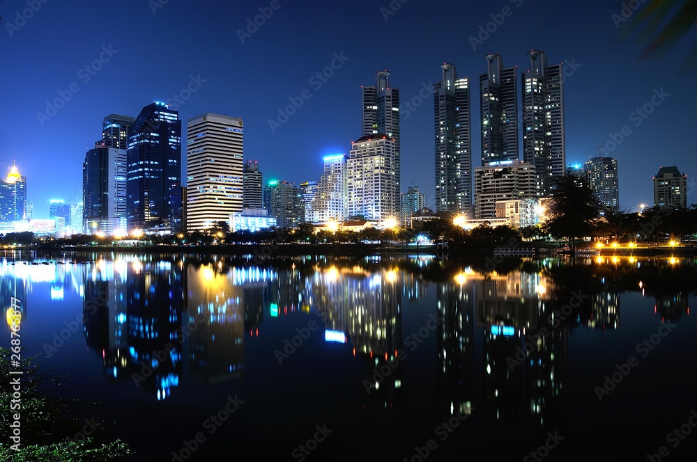 Naklejka premium mirror water with night city Bangkok Thailand
