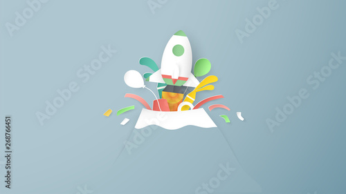 Vector illustration with start up concept in paper cut, craft and origami style. Rocket is flying. Template design for web banner, poster, cover, advertisement. It's art craft for kids. © Dai Yim