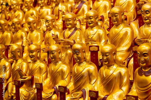 A lot of gold statues of the Lohans in Longhua Temple in Shanghai, China. Famous buddhist temple in China.
