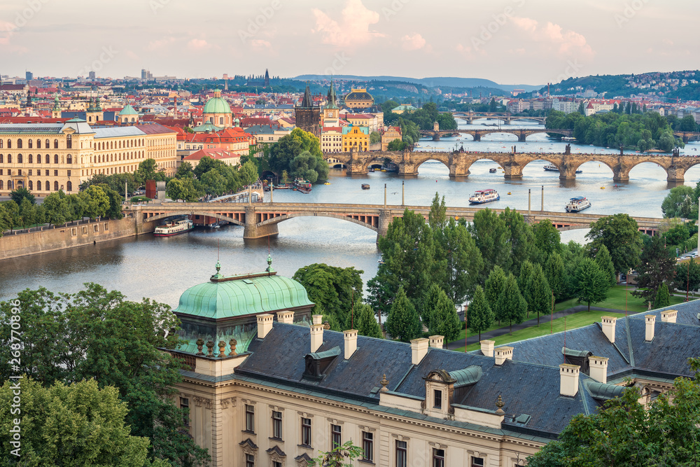 Beautiful Prague and its bridges / Aerial view of famous bridges in Old Town of Prague in Czech Republic over Vltava river before the sunset.