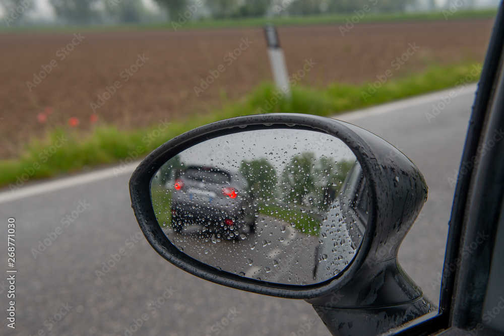 Rear-view mirror with water drops Rear-view mirror with water drops