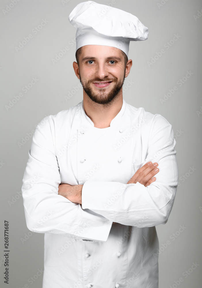 Male chef on light background