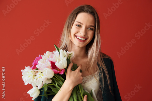 Young woman with bouquet of...