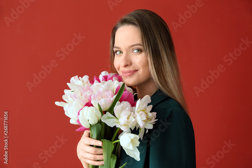 Young woman with bouquet of...