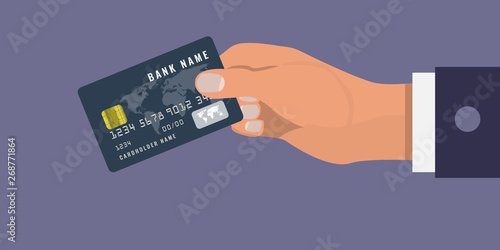 Bank credit card in the hand. Hand holding credit card with side view. Financial and online payments concept. Vector illustration