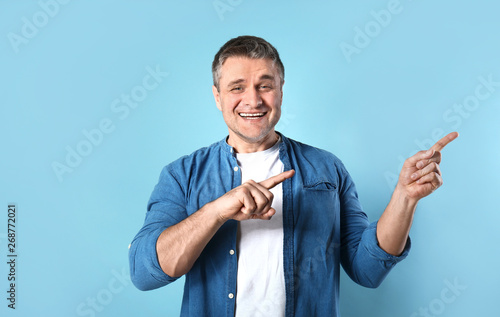 Handsome mature man pointin...