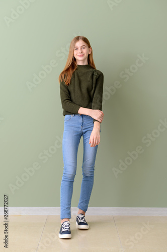 Cute teenage girl near colo...