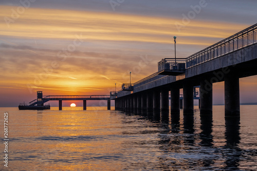 Red sunrise in Burgas on the bridge. Scenic sunrise. 