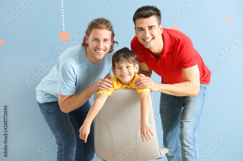 Happy gay couple with adopt...