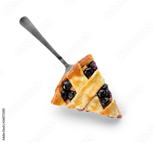 Piece of tasty blueberry pie on white background