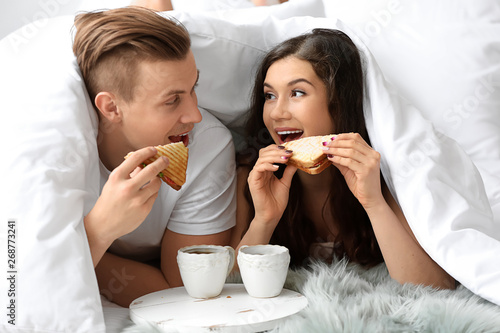 Cute young couple having br...