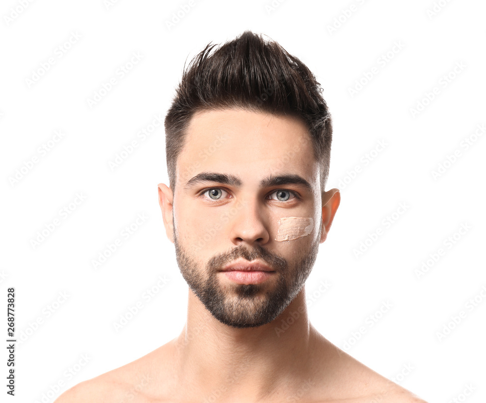 Handsome man with cosmetic clay on his face against white background Handsome man with cosmetic clay on his face against white background