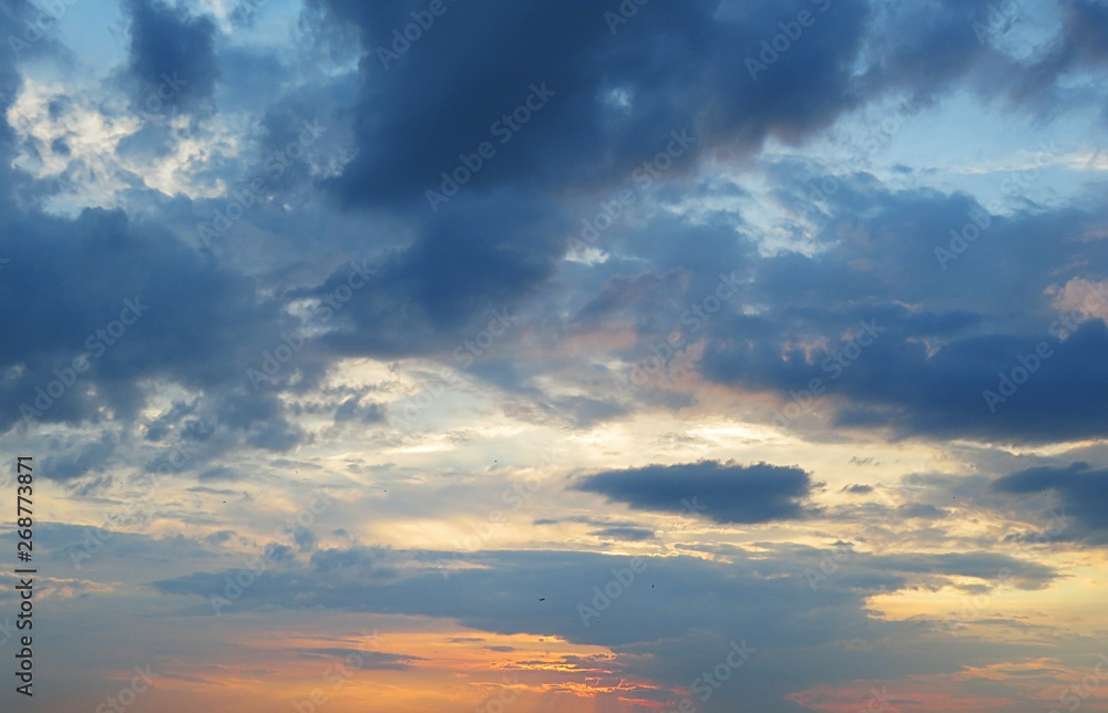 Beautiful orange sunset view with blue clouds, natural background