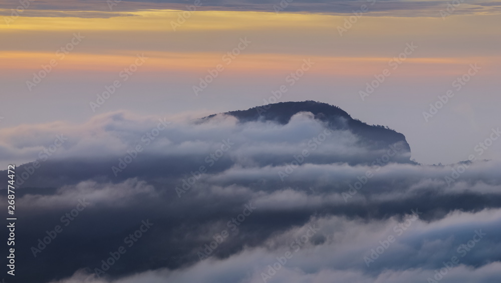 Fototapeta premium Panorama view sunrise at Doi Inthanon, mountain view morning of peak mountain Doi Hua Suea around with sea of fog with cloudy sky background, KM.41 view point Doi Inthanon, Chiang Mai, Thailand.