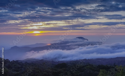 Panorama view sunrise at Doi Inthanon, mountain view morning of peak mountain Doi Hua Suea around with sea of fog with cloudy sky background, KM.41 view point Doi Inthanon, Chiang Mai, Thailand.