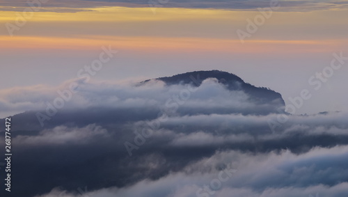 Panorama view sunrise at Doi Inthanon, mountain view morning of peak mountain Doi Hua Suea around with sea of fog with cloudy sky background, KM.41 view point Doi Inthanon, Chiang Mai, Thailand.