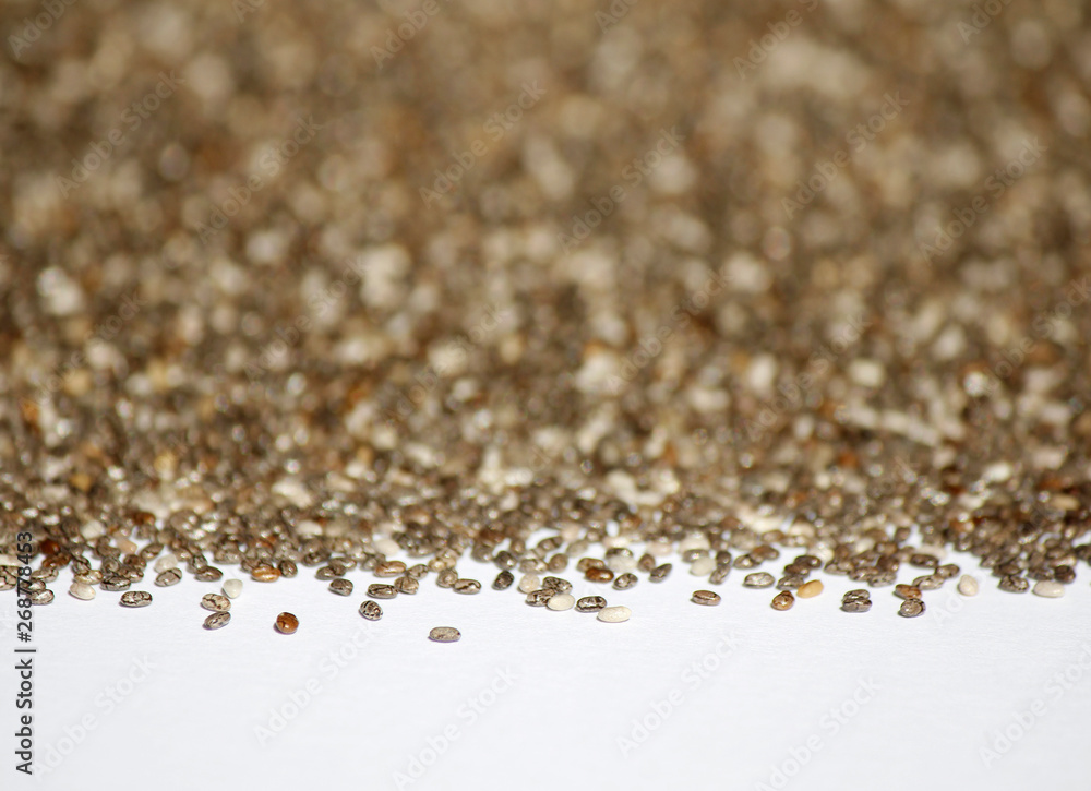 Chia seed on white with blurred background. Chia seed on white with blurred background.