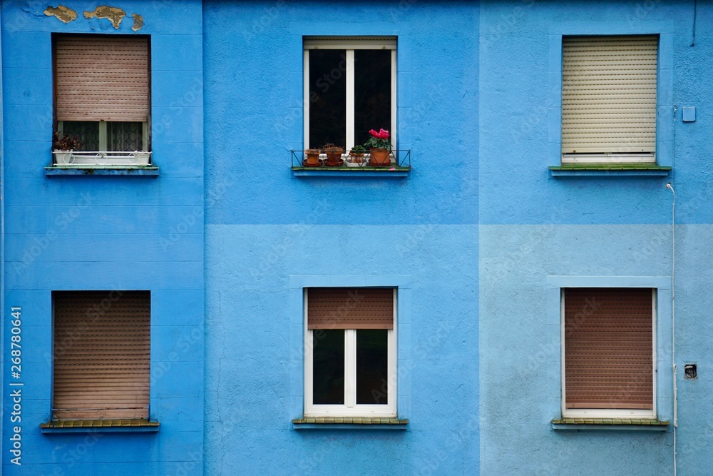 window on the blue building facade in Bilbao city Spain, window in the street
