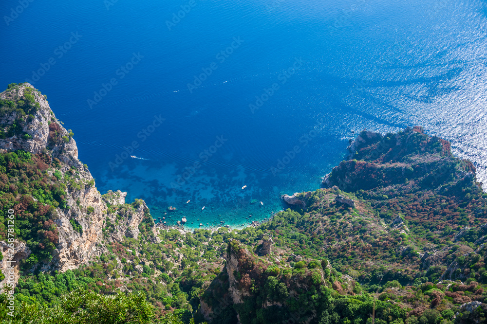 Scenic view of the dazzling Mediterranean blue waters from the dramatic clifftop mountain coastline of the island of Capri, Italy 
