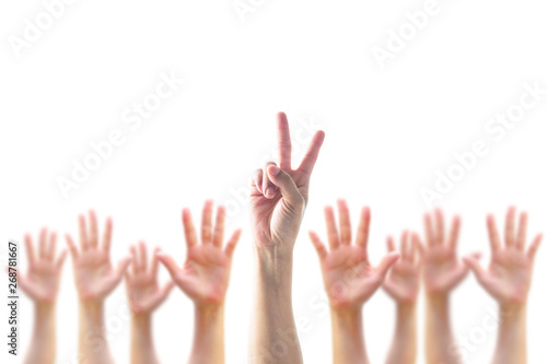 Participation, leadership, volunteer concept with V- Victory sign on leader's two fingers among blur hands crowd isolated on white background