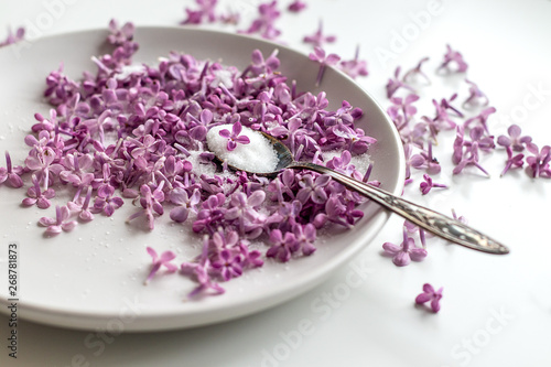 Homemade preparing of lilac sugar with amazing fragrance